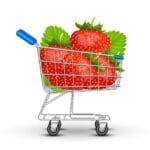 Cartoon shoping cart with red strawberries inside