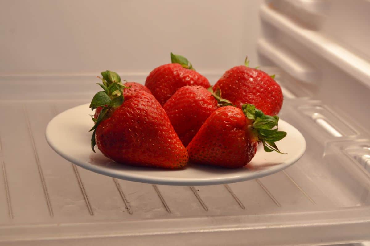 Ripe fresh strawberries in refrigerator