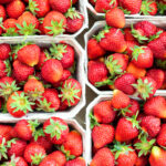 Ripe fresh strawberries in containers ready to storage