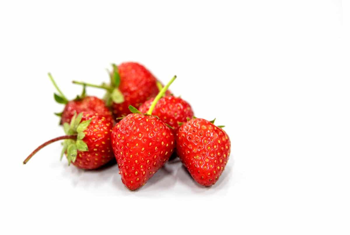 Close shot of ripe fresh strawberries white background
