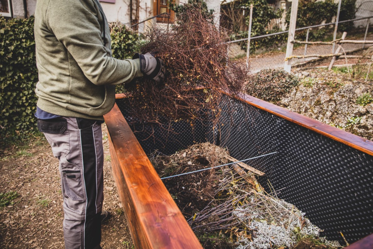 Filling the garden bed with branches leaves bottom layer.