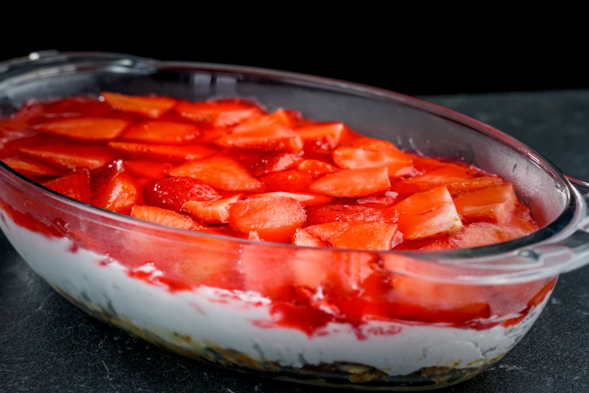 Strawberry pretzel salad in a glass container.